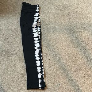 Black leggings with a pattern on the side on the legs